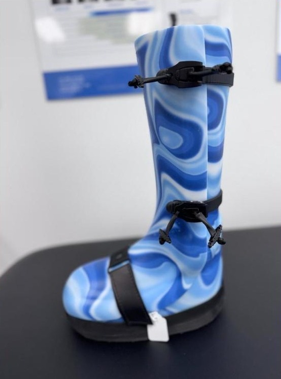 Custom CROW walker in a blue swirl pattern with a rocker sole, made by WingTek