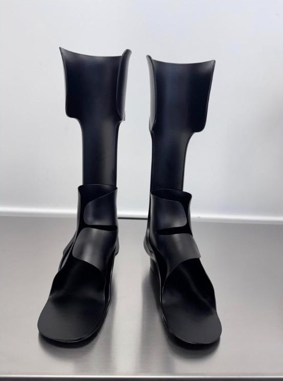 Pair of black energy storage and return (ESR) ankle foot orthoses made by WingTek