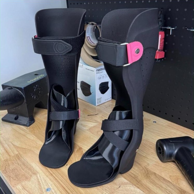 Black custom solid ankle foot orthoses made by WingTek