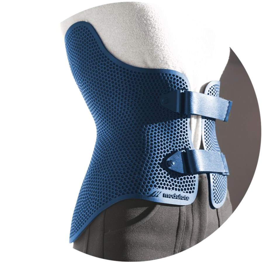 Close view of a blue 3D printed scoliosis brace with a honeycomb pattern for airflow